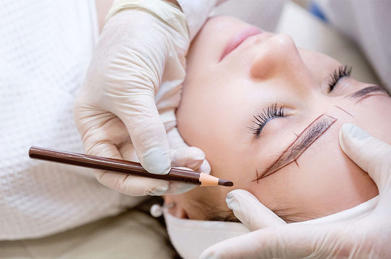 Woman getting microblading done